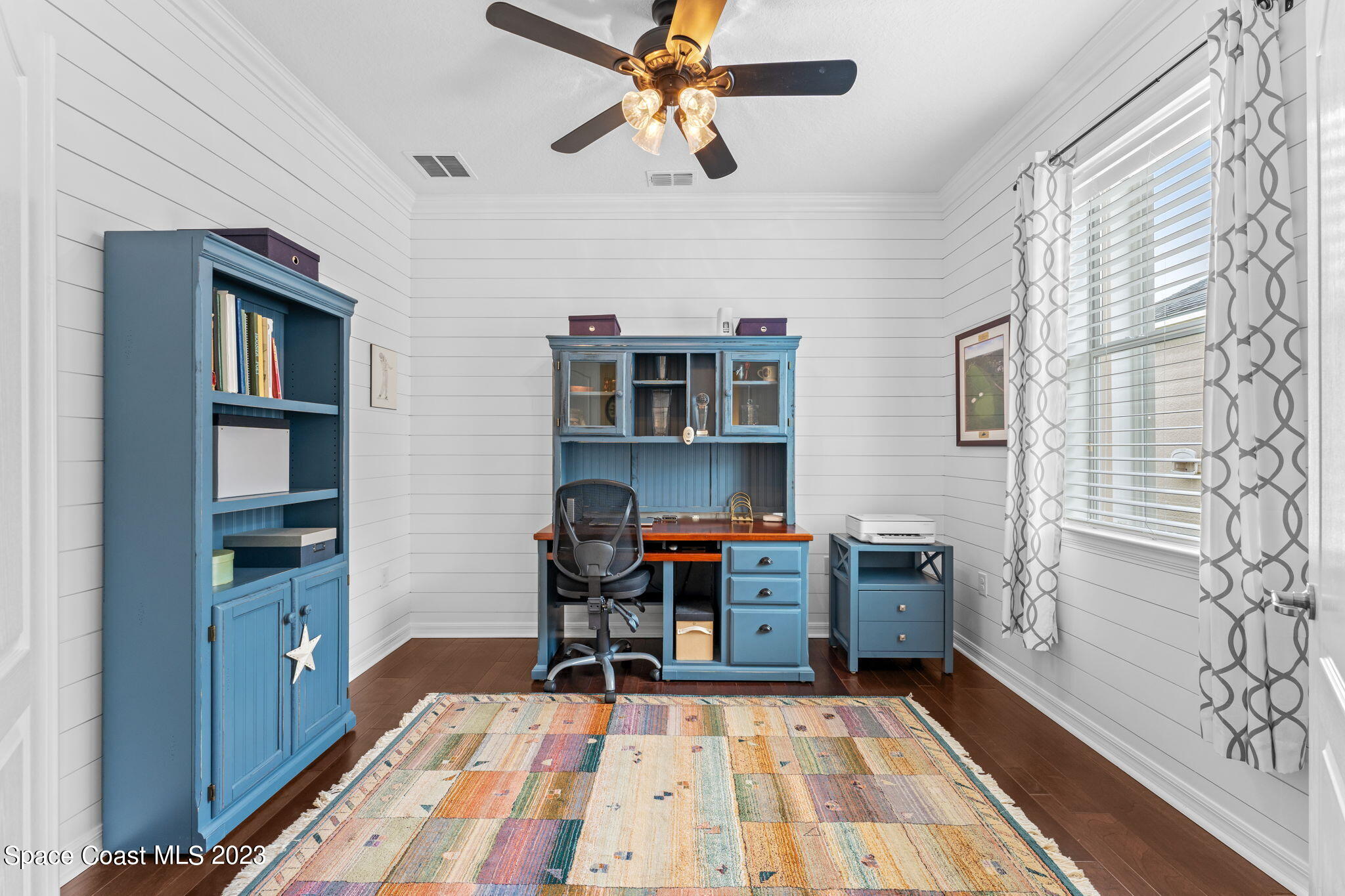 3428 Ahern Place Melbourne, FL 32940 - Photo 10 of 64 a room with furniture a rug and a window