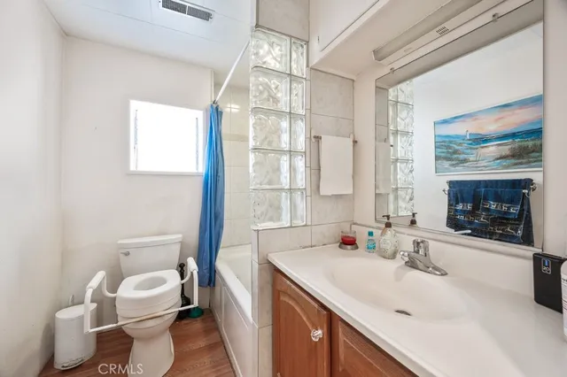 a bathroom with a bathtub and a toilet