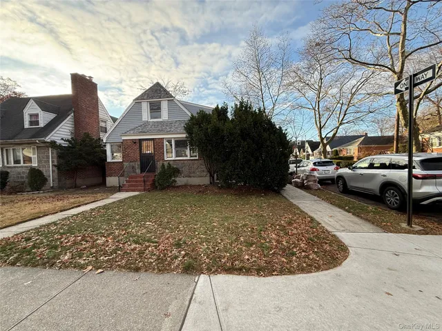 a view of a car park in front of house
