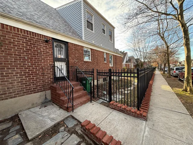 a view of a brick building with many windows