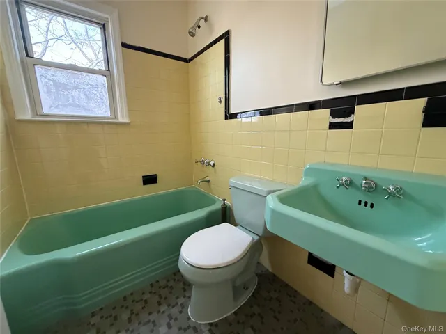 a bathroom with a sink toilet and bathtub