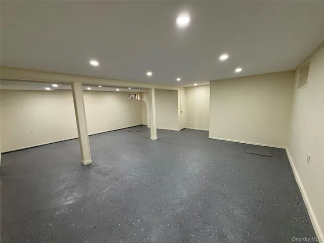 an empty room with a hallway