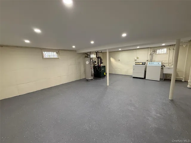 an empty room with furniture and window