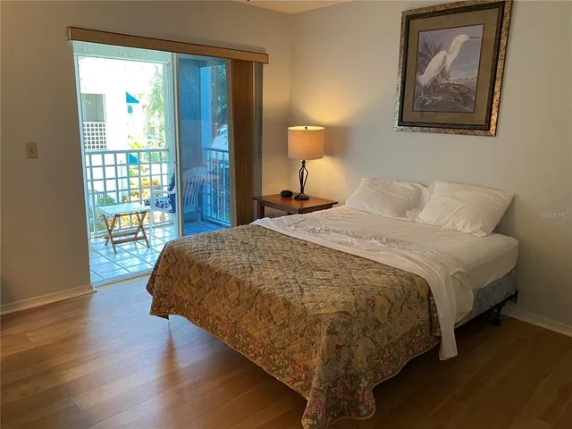 a view of a lake with houses in the back