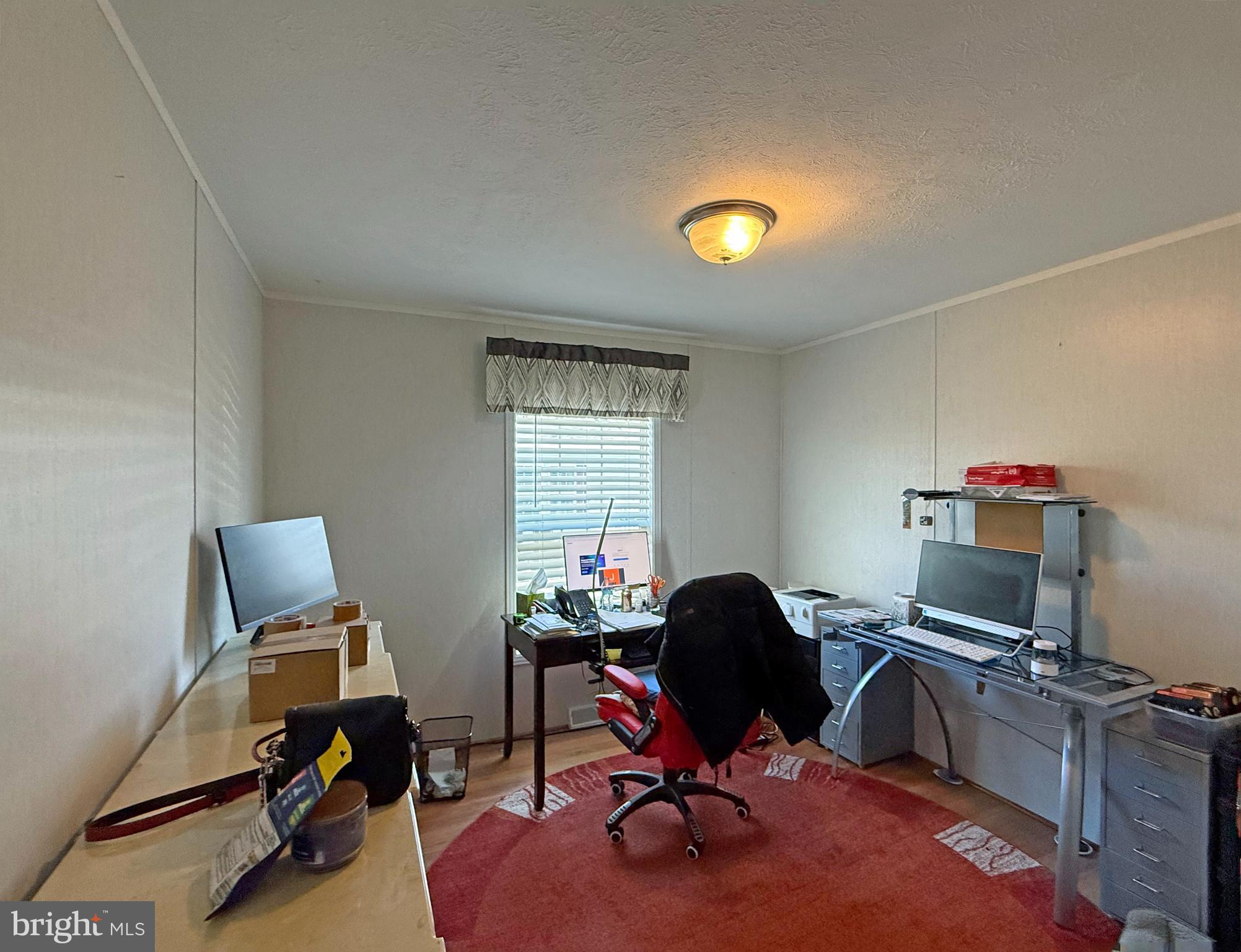 31655 Janice Road, Unit A36 Lewes, DE 19958 - Photo 16 of 32 a view of a workspace with furniture and a window