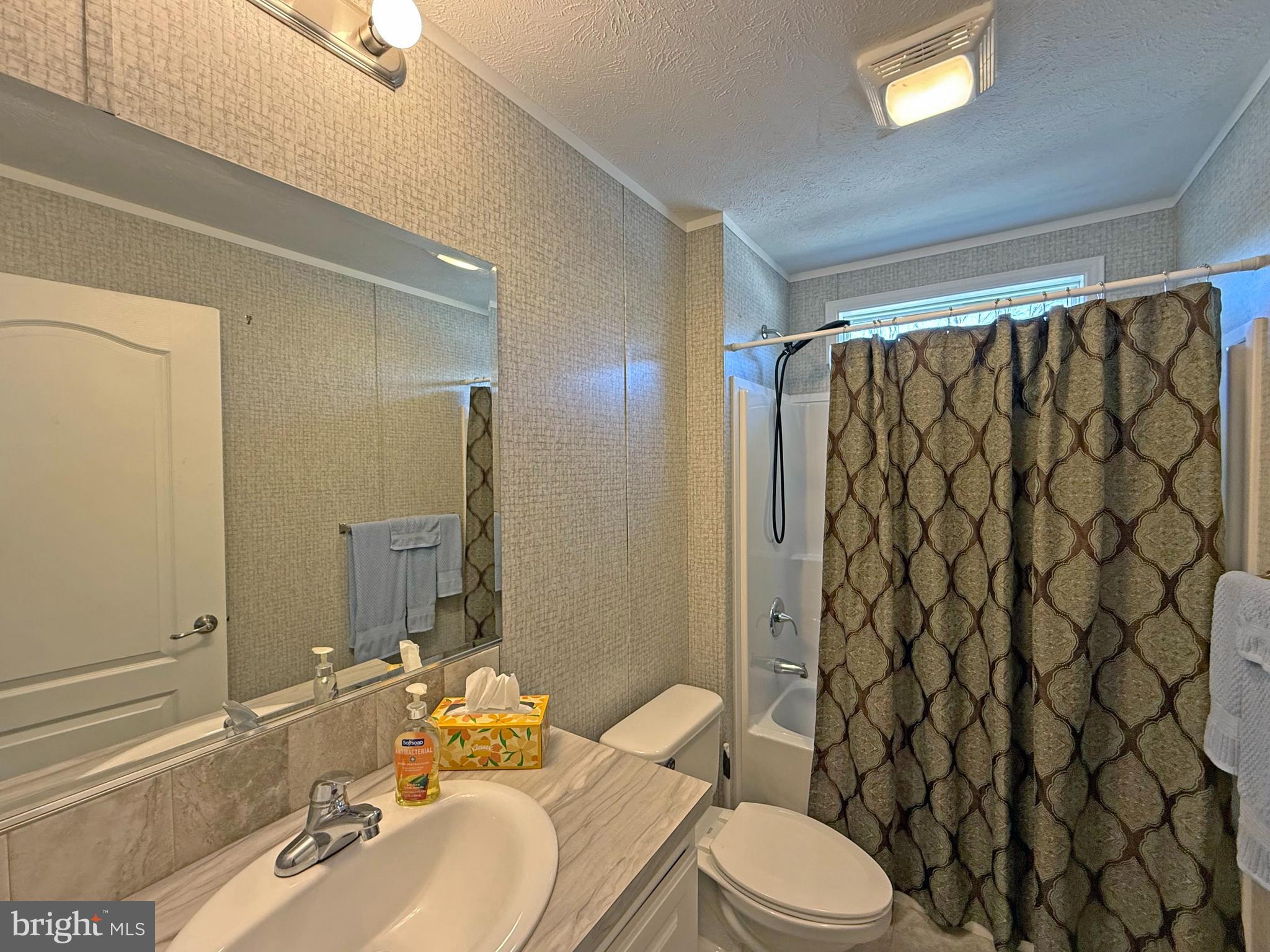 31655 Janice Road, Unit A36 Lewes, DE 19958 - Photo 19 of 32 a bathroom with a sink and toilet