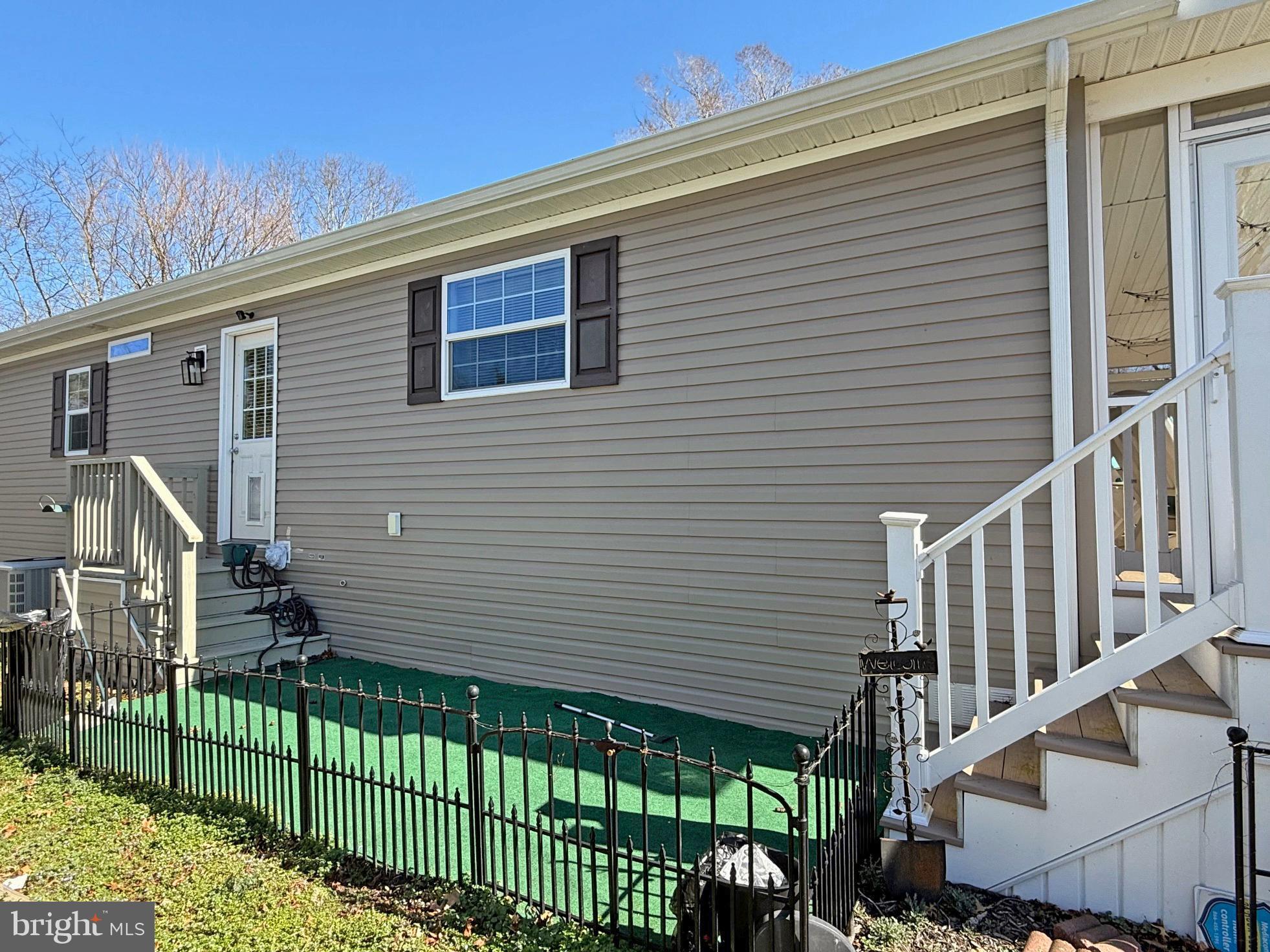31655 Janice Road, Unit A36 Lewes, DE 19958 - Photo 25 of 32 a front view of a house with a garden