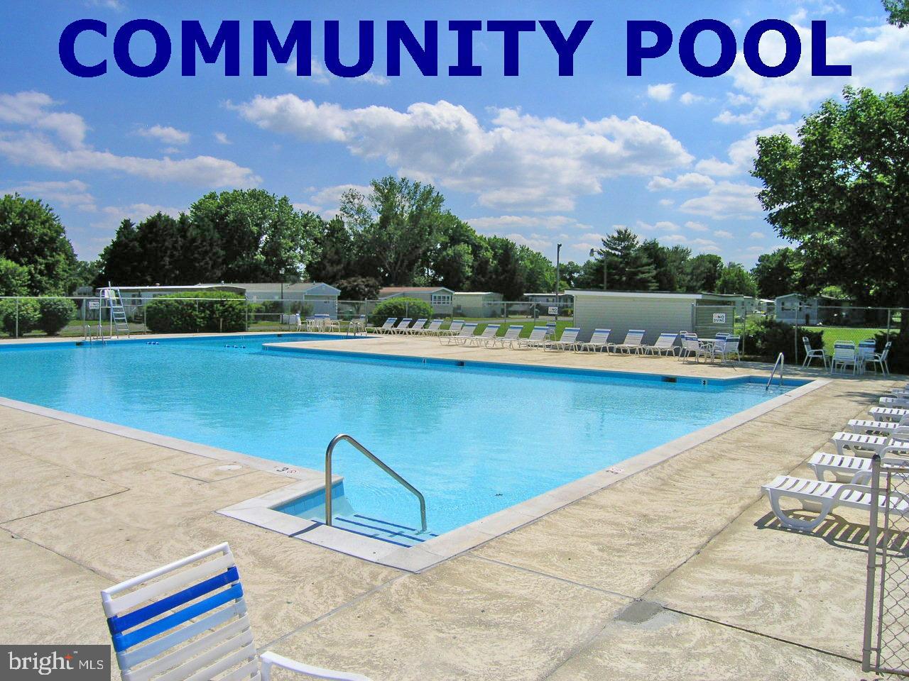 31655 Janice Road, Unit A36 Lewes, DE 19958 - Photo 31 of 32 a view of outdoor space with swimming pool and green space