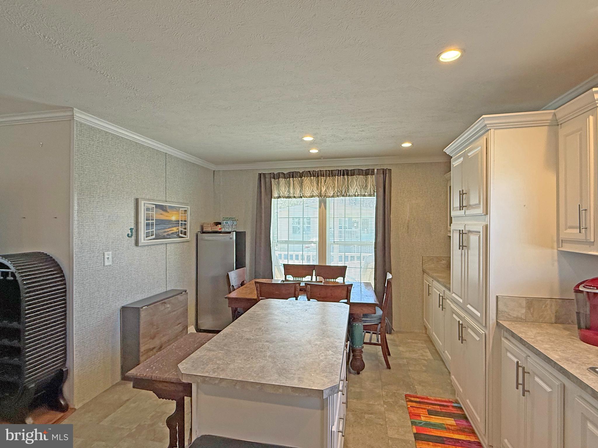 31655 Janice Road, Unit A36 Lewes, DE 19958 - Photo 10 of 32 a very nice looking dining room with a large window