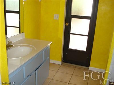 17517 Allentown Road Fort Myers, FL 33967 - Photo 7 of 9 a bathroom with a sink and a shower