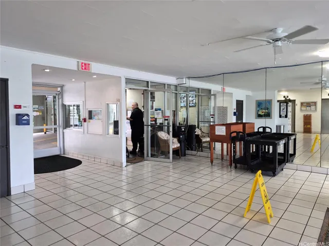 a view of residential houses with yard and swimming pool