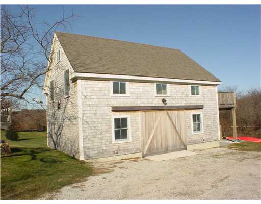 1167 Grace Cove Road Block Island, RI 02807 - Photo 11 of 11 Exterior Front. Garage building has living quarters on second level. Assessory to the main house is current use with 2 bedrooms, 1 bath and large living space. Gargae and storage on first level.
