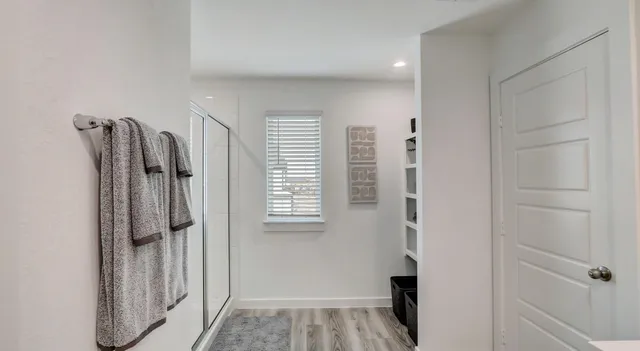 a view of walk in closet with window