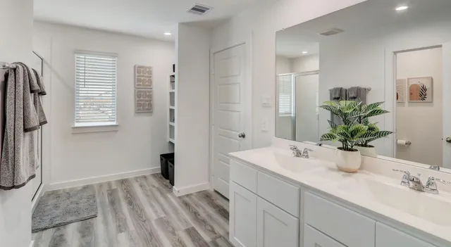 a bathroom with a sink a faucet and a mirror