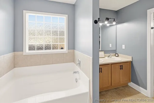 a bathroom with a bathtub and a sink