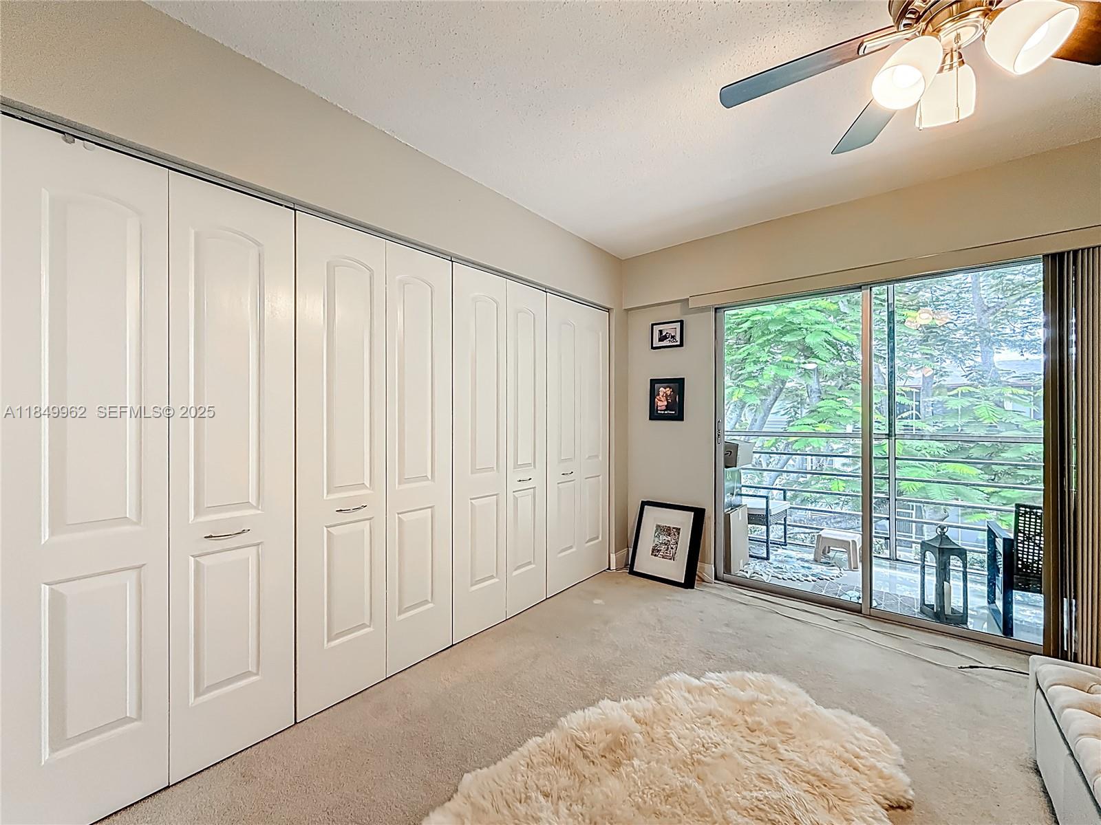 618 Fanshaw O, Unit 618 Boca Raton, FL 33434 - Photo 27 of 40 a spacious bedroom with a balcony and large window