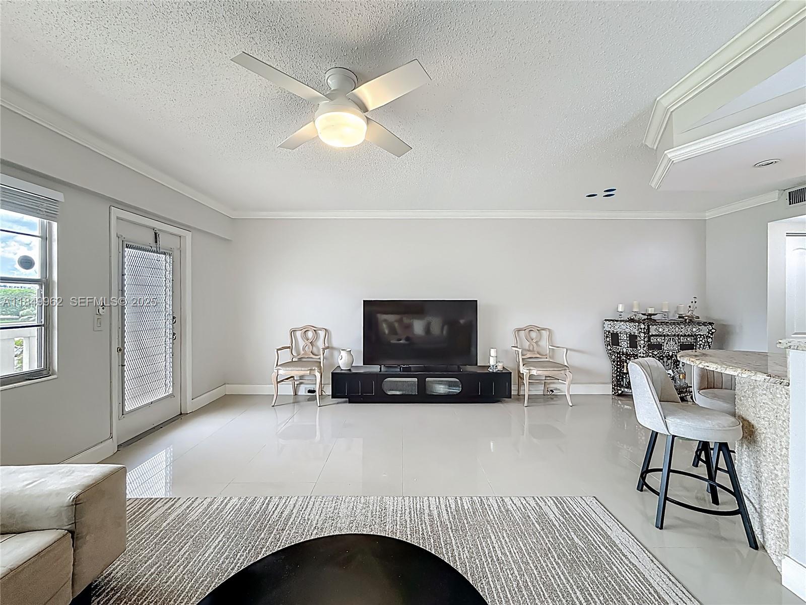 618 Fanshaw O, Unit 618 Boca Raton, FL 33434 - Photo 10 of 40 a bedroom with furniture and a fireplace