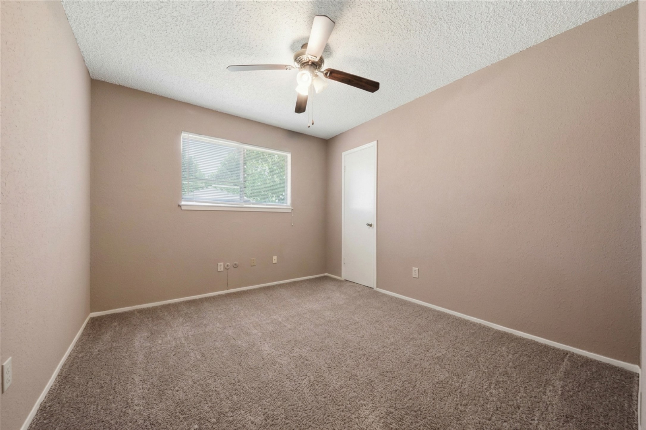 4019 Postwood Drive Spring, TX 77388 - Photo 31 of 50 an empty room with a window and a fan