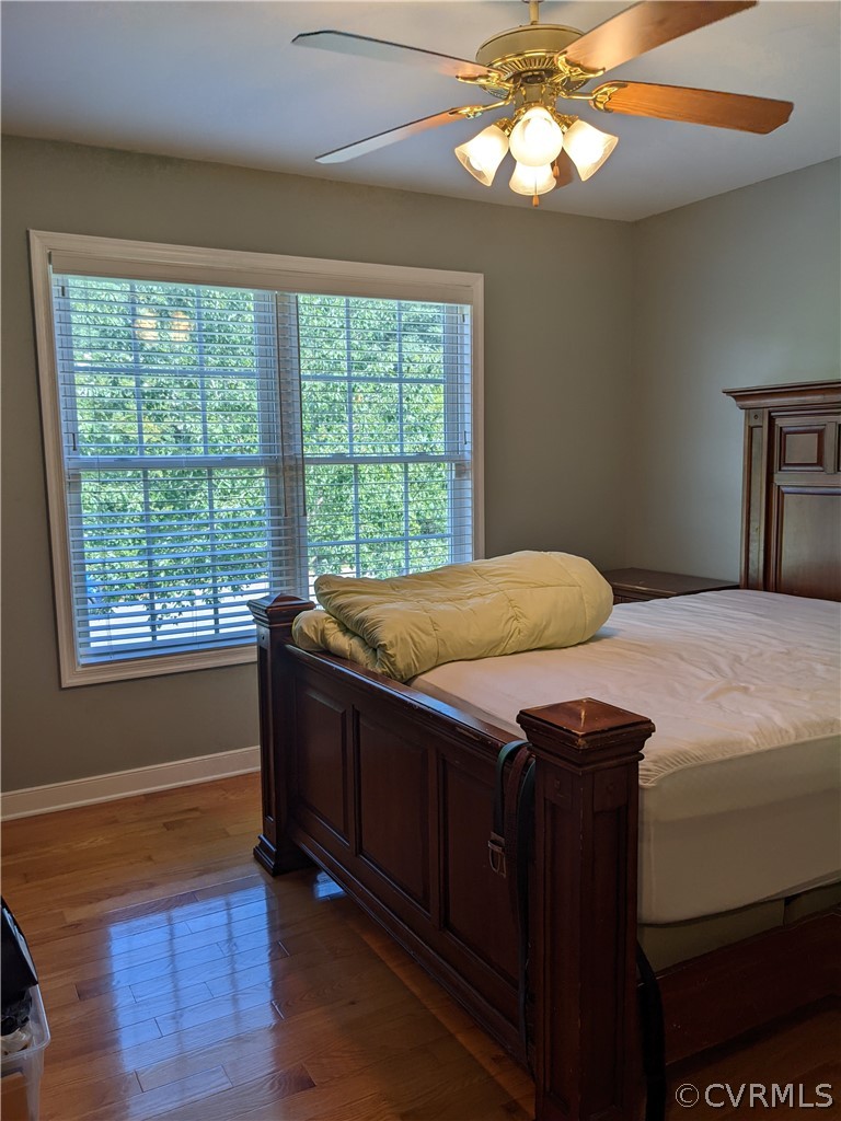 11624 Hillside Road Chester, VA 23831 - Photo 13 of 20 a bedroom with a bed and a window