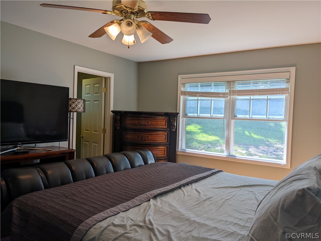 11624 Hillside Road Chester, VA 23831 - Photo 17 of 20 a bedroom with a bed and a television