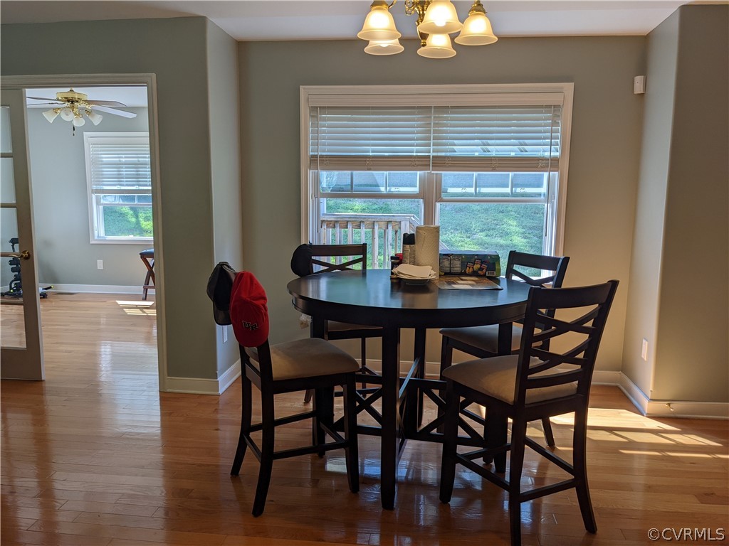 11624 Hillside Road Chester, VA 23831 - Photo 6 of 20 a dining room with furniture and wooden floor