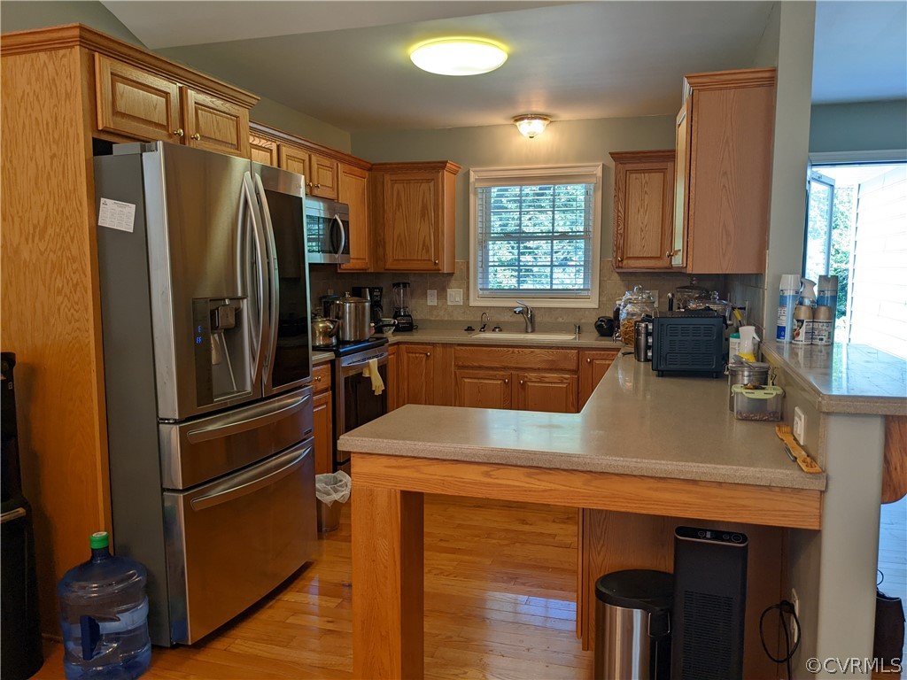 11624 Hillside Road Chester, VA 23831 - Photo 7 of 20 a kitchen with stainless steel appliances a sink stove and refrigerator