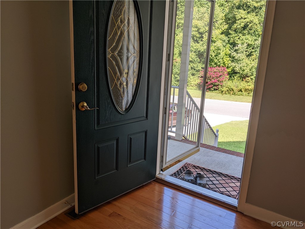 11624 Hillside Road Chester, VA 23831 - Photo 10 of 20 a view of walk in closet with wooden floor
