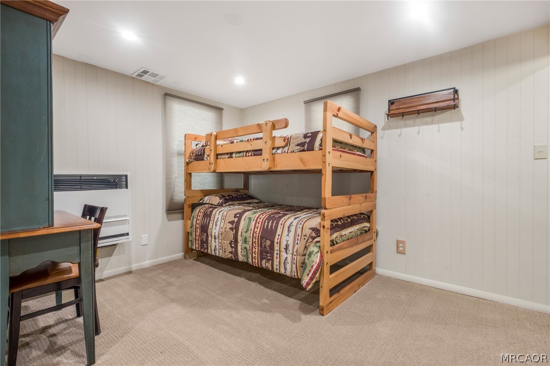 195 Elgin Road Big Bear Lake, CA 92315 - Photo 20 of 45 a bedroom with a bed and a table in it