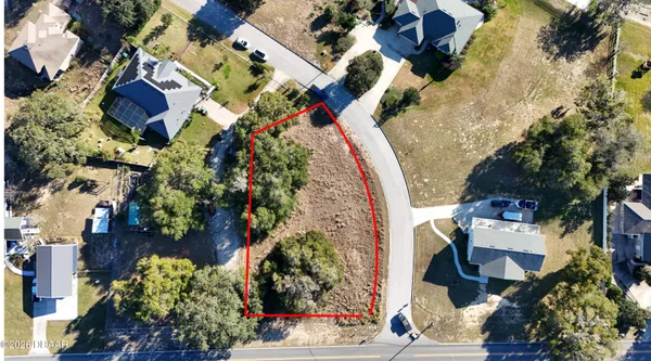 an aerial view of residential house with outdoor space and swimming pool