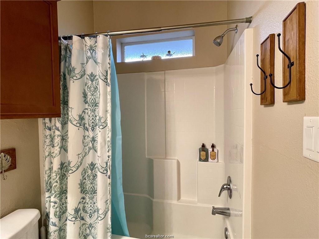 1198 Jones-Butler Road, Unit 3009 College Station, TX 77840 - Photo 12 of 20 a bathroom with a shower and a shower curtain