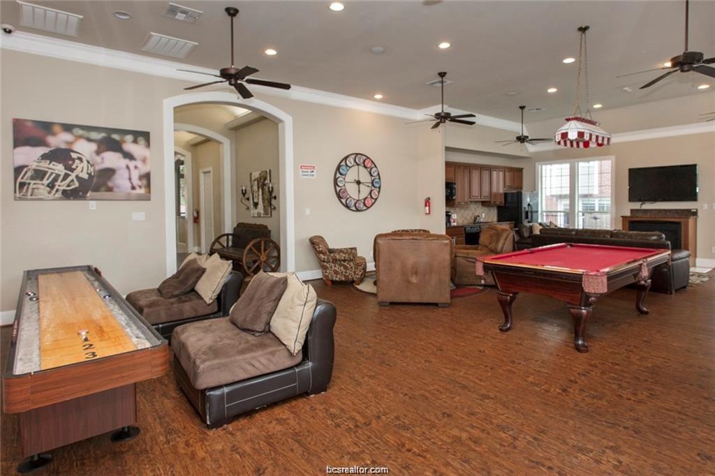 1198 Jones-Butler Road, Unit 3009 College Station, TX 77840 - Photo 17 of 20 a living room with furniture a flat screen tv and a window