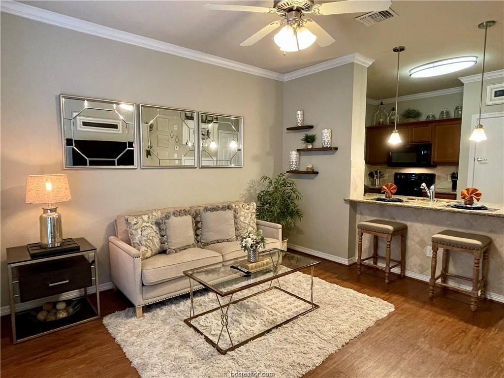 1198 Jones-Butler Road, Unit 3009 College Station, TX 77840 - Photo 2 of 20 a living room with furniture and a flat screen tv