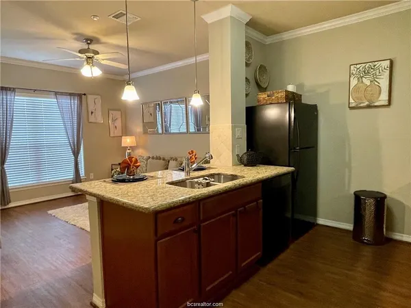a bathroom with a sink a counter space and a mirror
