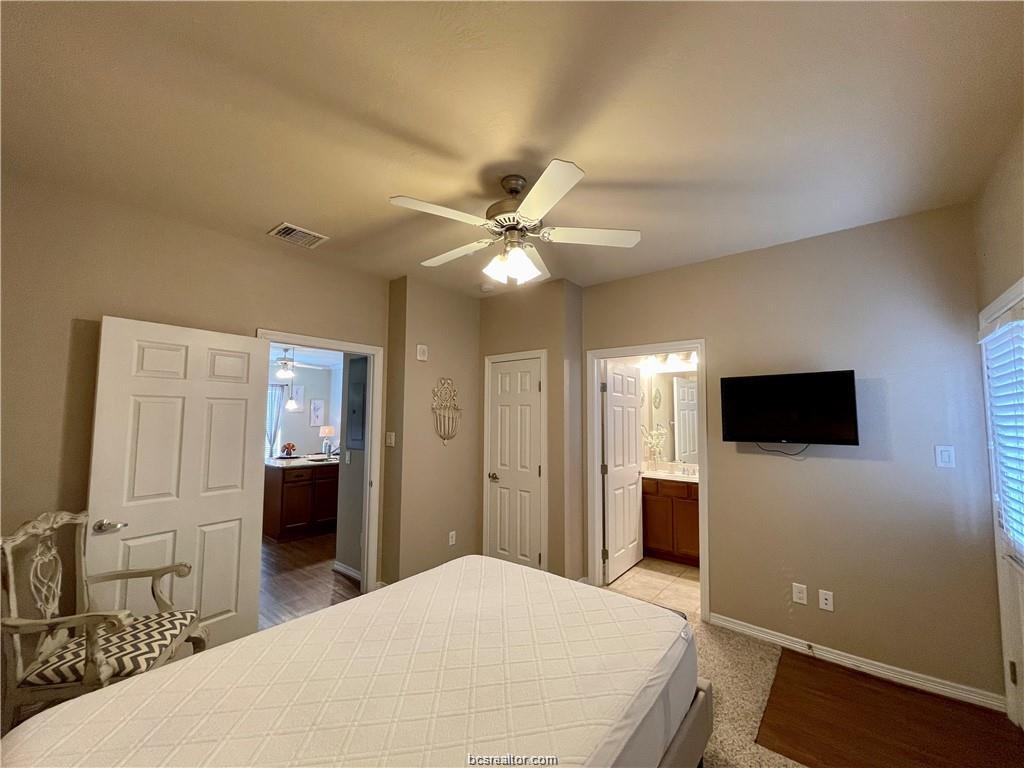 1198 Jones-Butler Road, Unit 3009 College Station, TX 77840 - Photo 9 of 20 a bedroom with a bed and a television