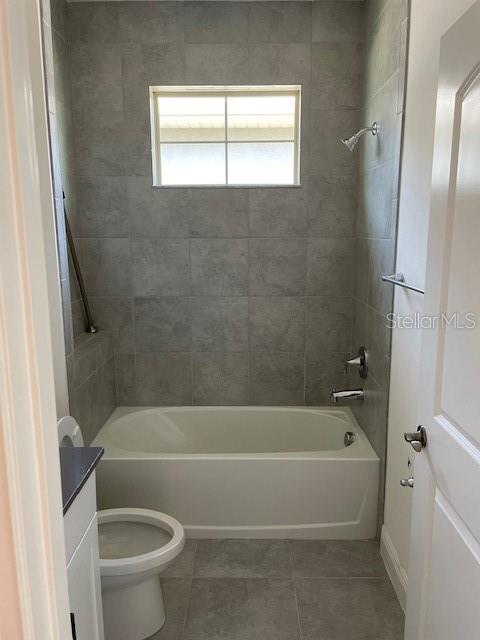 7501 Wing Span Way Harmony, FL 34773 - Photo 15 of 30 a bathroom with a toilet and a bath tub