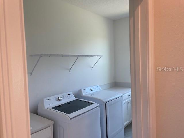 7501 Wing Span Way Harmony, FL 34773 - Photo 16 of 30 a utility room with dryer and washer