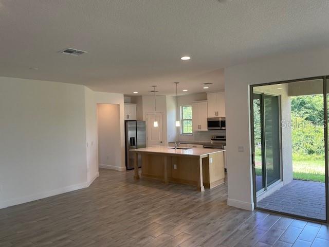 7501 Wing Span Way Harmony, FL 34773 - Photo 5 of 30 a view of a kitchen and kitchen island