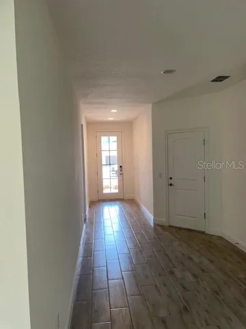 a view of an empty room and window