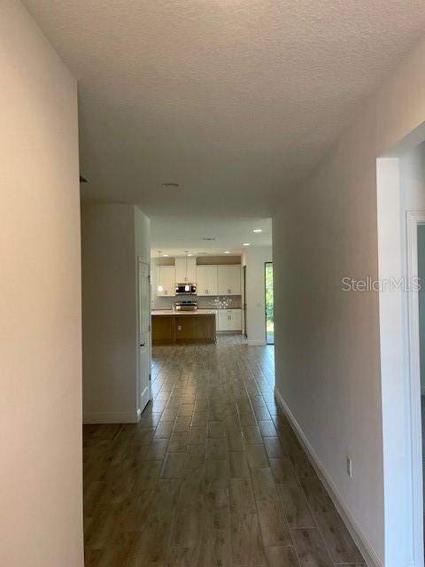 7501 Wing Span Way Harmony, FL 34773 - Photo 10 of 30 a view of a kitchen with a sink stove oven and cabinets