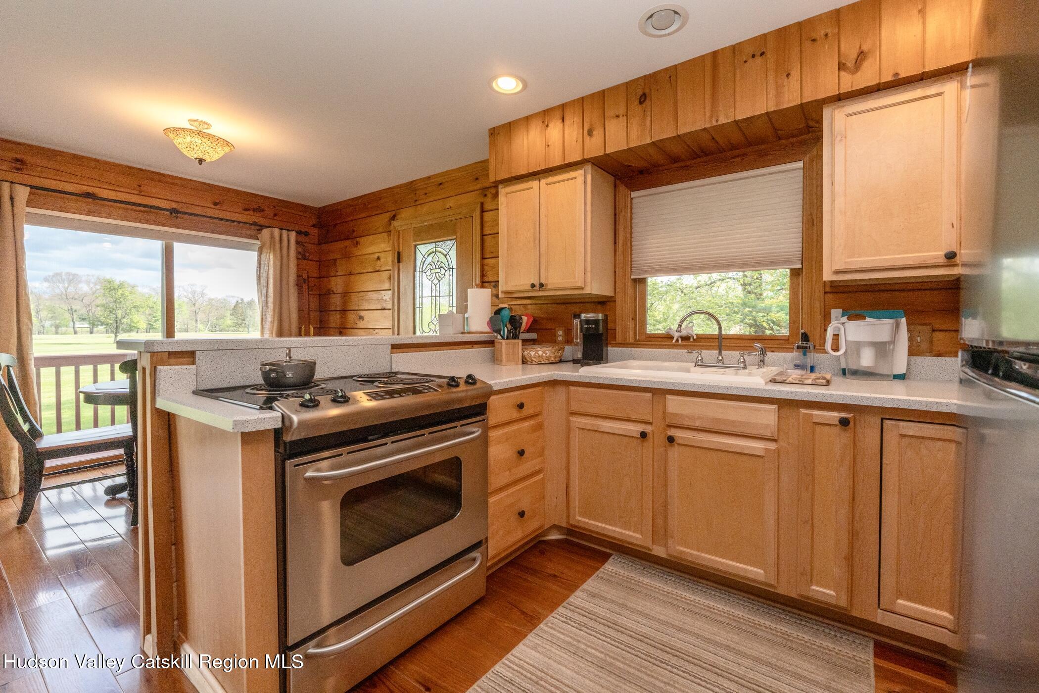 140 Stone Dock Road High Falls, NY 12440 - Photo 11 of 42 a kitchen with stainless steel appliances a stove sink and cabinets