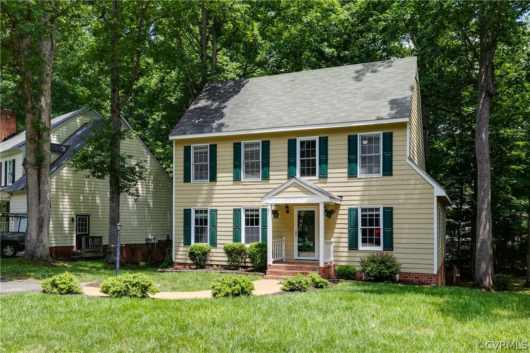 front view of a house with a yard