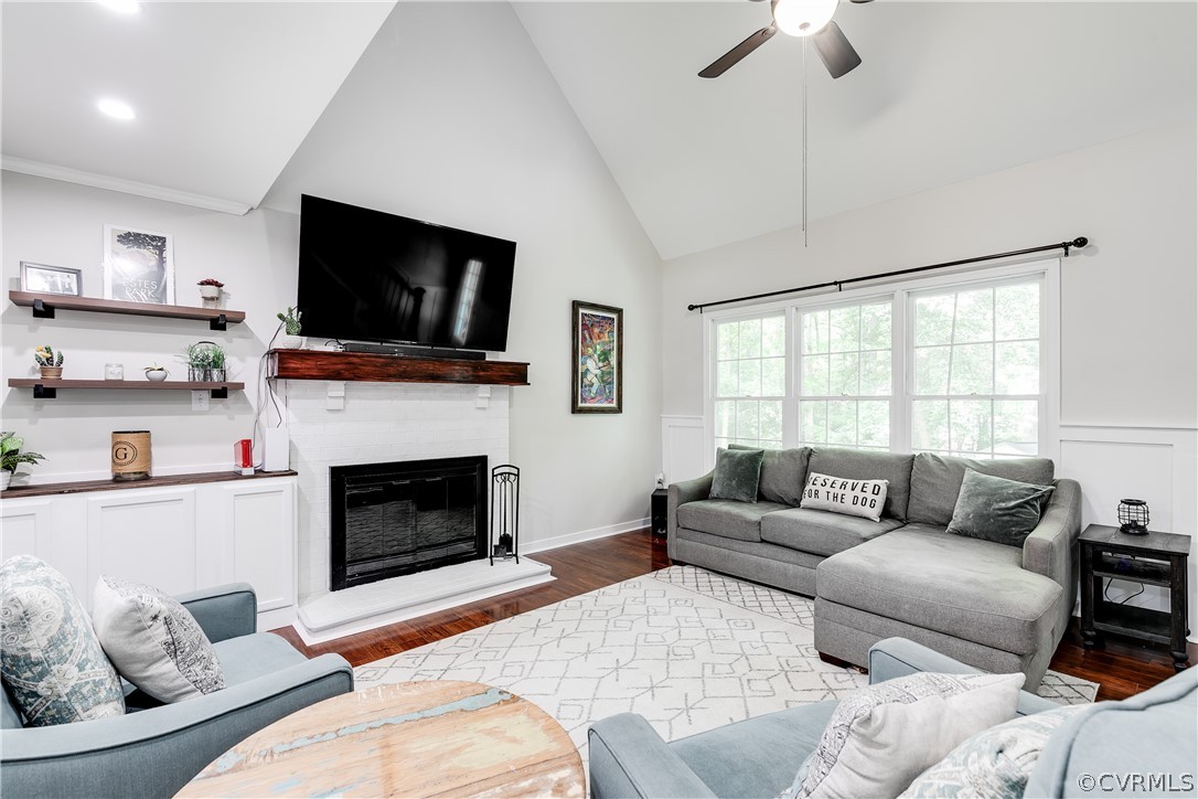 5615 Chatmoss Road Midlothian, VA 23112 - Photo 12 of 41 a living room with furniture a fireplace and a flat screen tv