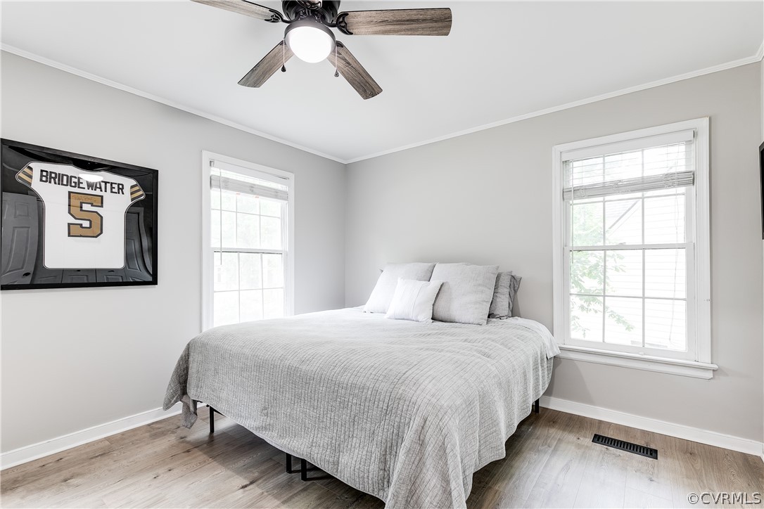 5615 Chatmoss Road Midlothian, VA 23112 - Photo 28 of 41 a bedroom with a bed and wooden floor