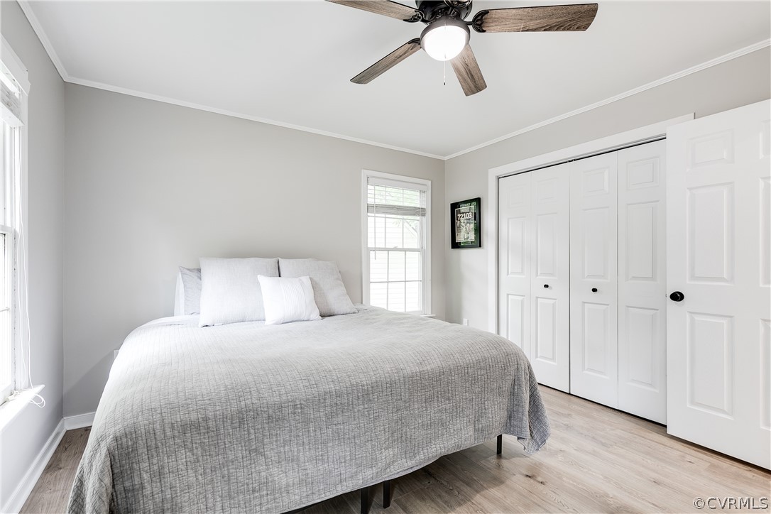 5615 Chatmoss Road Midlothian, VA 23112 - Photo 30 of 41 a bedroom with a large bed and a chandelier