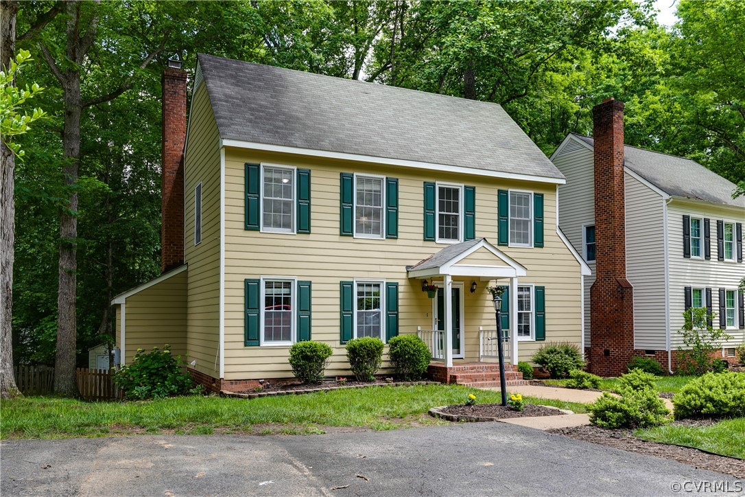 5615 Chatmoss Road Midlothian, VA 23112 - Photo 41 of 41 a front view of a house with a yard and trees