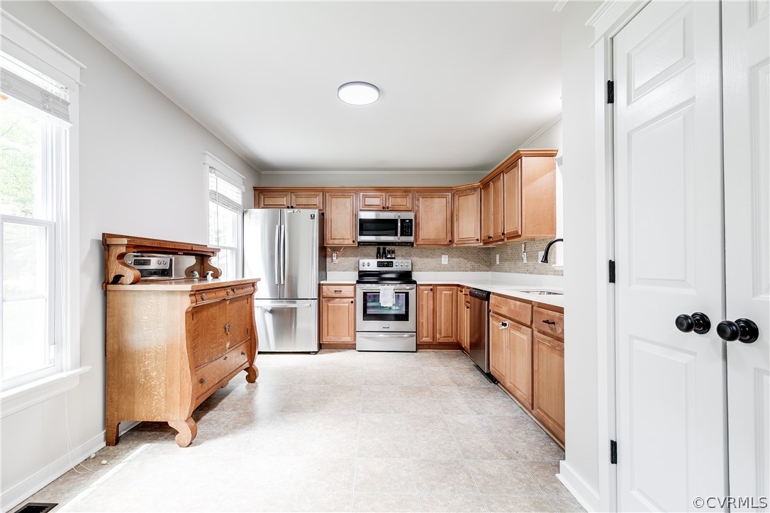 5615 Chatmoss Road Midlothian, VA 23112 - Photo 5 of 41 a kitchen with granite countertop a refrigerator oven a sink dishwasher and white cabinets with wooden floor