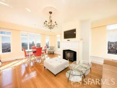 a living room with furniture fireplace and a flat screen tv