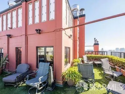 a patio with table and chairs