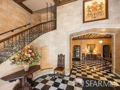 a view of a entryway door with a rug
