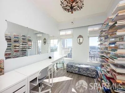 a bedroom with a bed and a window with the outer view